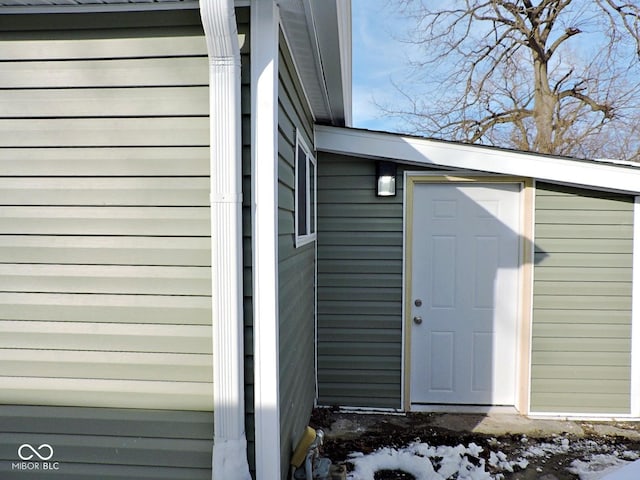 view of snow covered property entrance