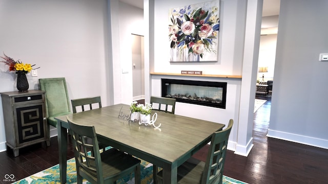 dining area featuring dark hardwood / wood-style floors