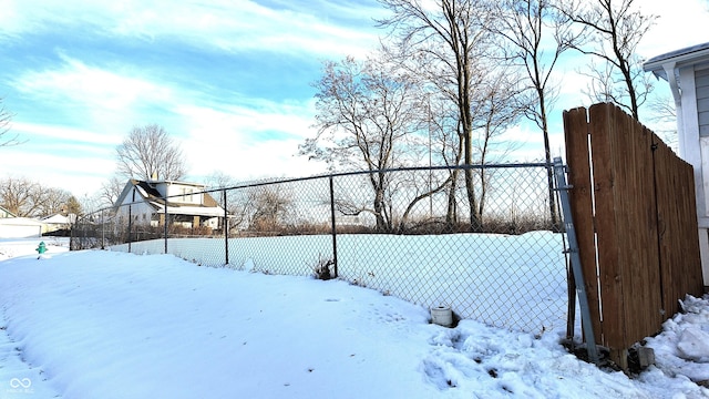 view of yard layered in snow