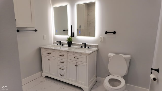 bathroom with toilet and vanity