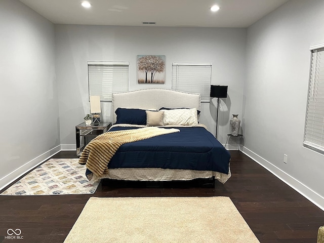 bedroom featuring dark wood-type flooring