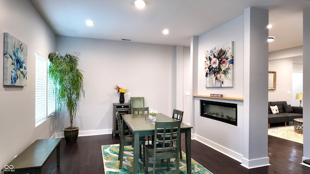 dining room with dark hardwood / wood-style floors