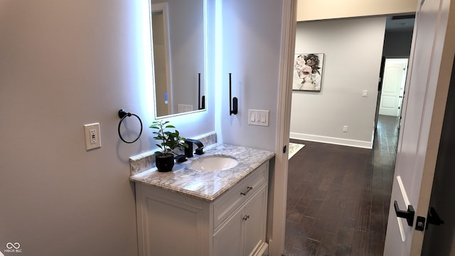 bathroom with wood-type flooring and vanity