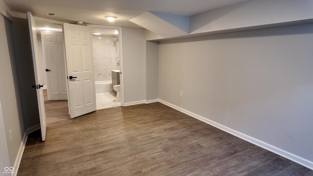 basement with dark wood-type flooring