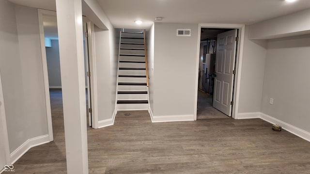 basement featuring dark hardwood / wood-style floors