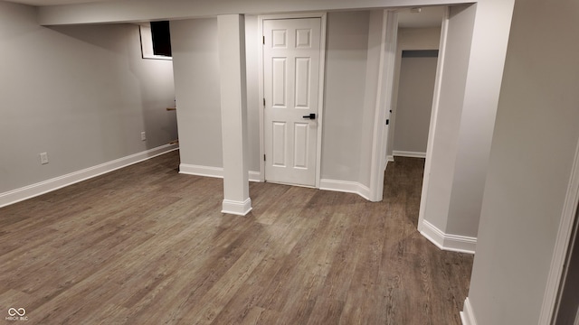 basement with dark wood-type flooring