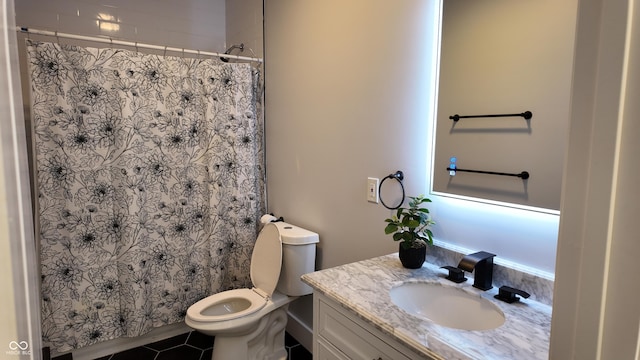 bathroom with toilet, a shower with shower curtain, tile patterned floors, and vanity