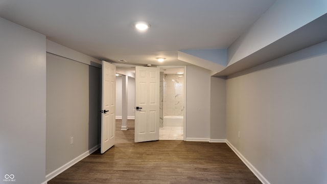 basement featuring dark hardwood / wood-style floors