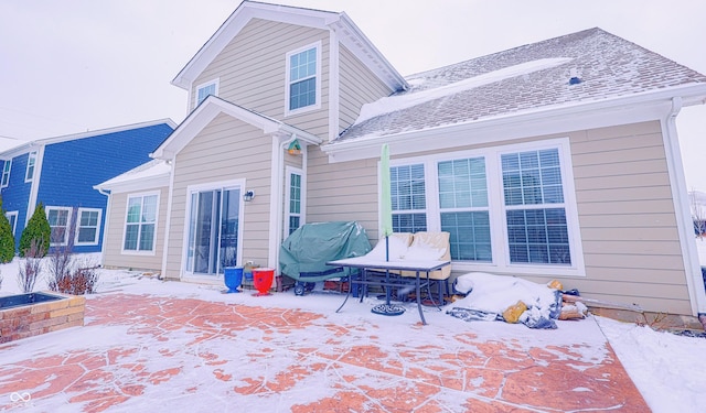 view of snow covered house