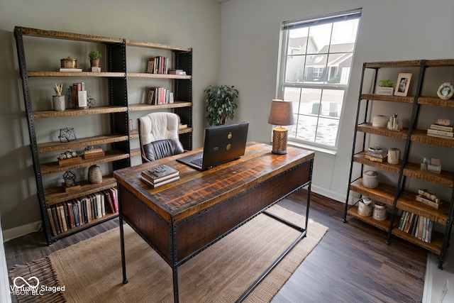 office with dark hardwood / wood-style flooring