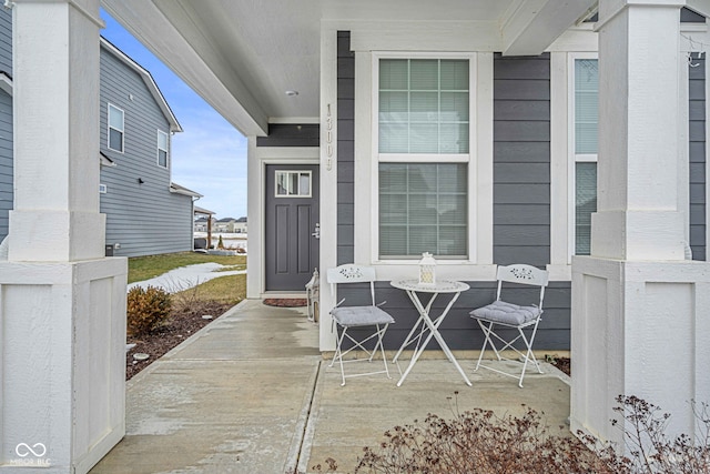 property entrance with covered porch