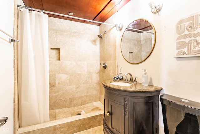 bathroom featuring walk in shower, vanity, tile patterned floors, and toilet