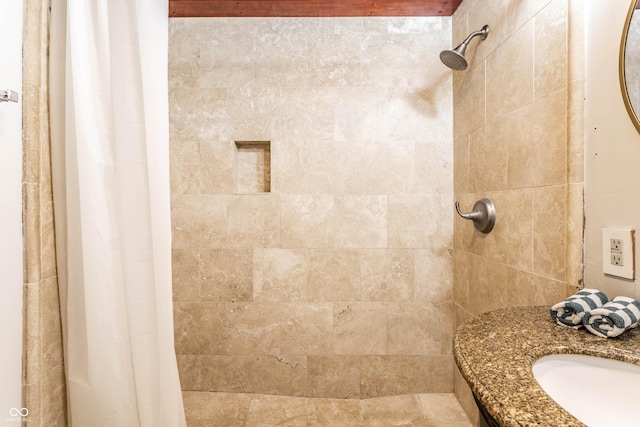 bathroom with sink and curtained shower