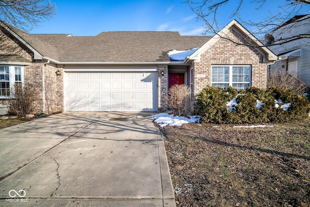 ranch-style house featuring a garage