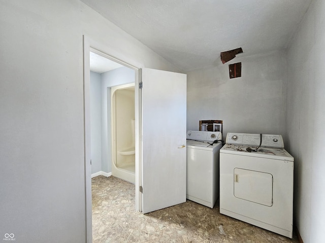 laundry area with independent washer and dryer