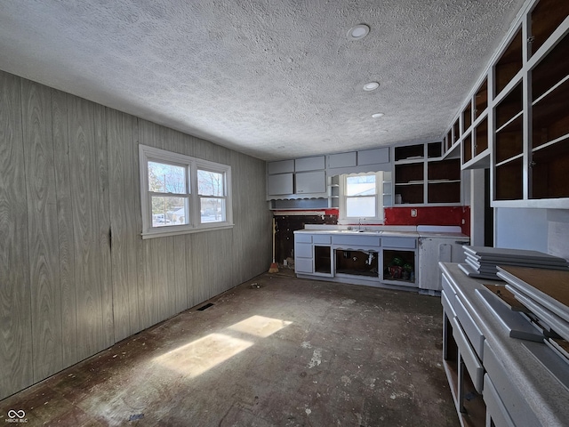 kitchen featuring sink and a textured ceiling