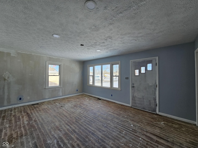 entryway featuring a textured ceiling and plenty of natural light