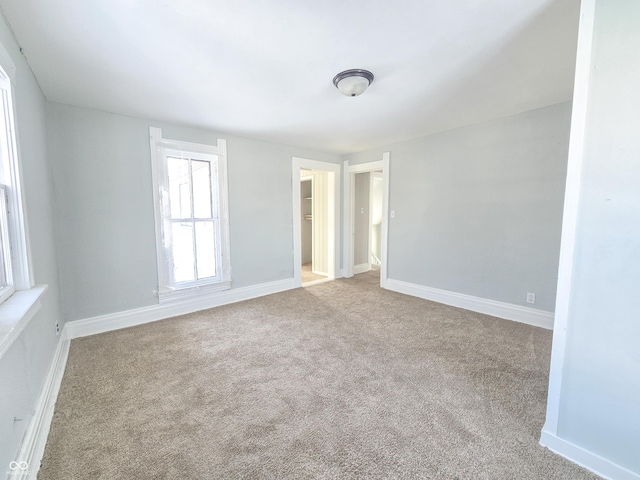 empty room with light colored carpet