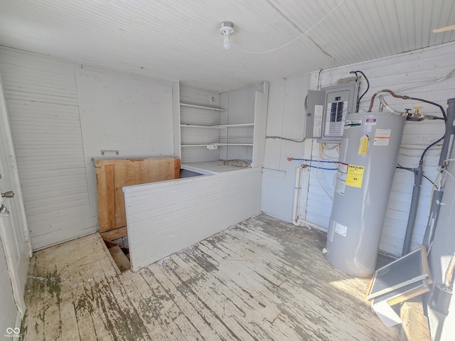 utility room featuring water heater and electric panel