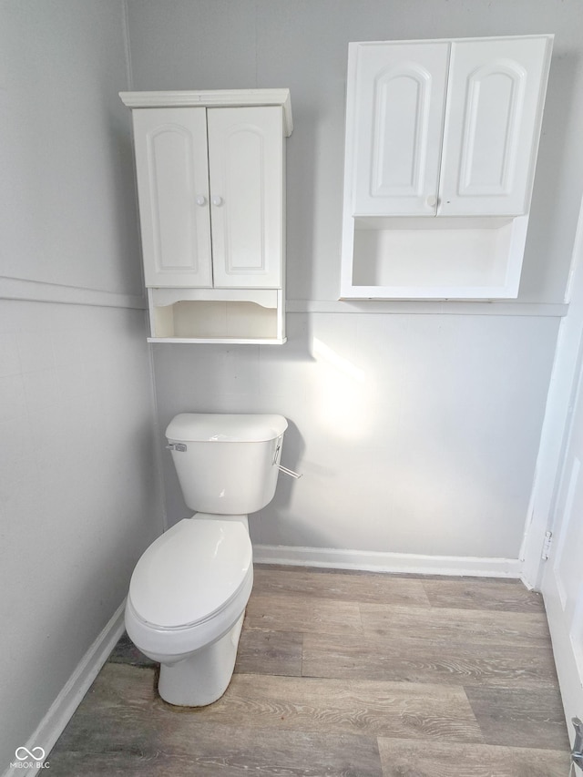 bathroom featuring toilet and hardwood / wood-style flooring