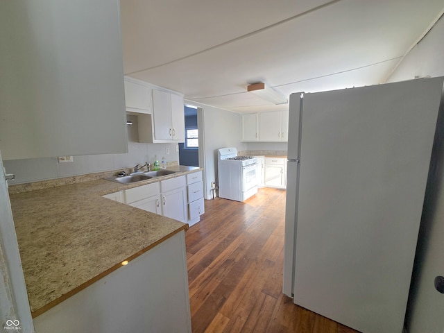 kitchen featuring dark hardwood / wood-style flooring, sink, white appliances, and white cabinetry