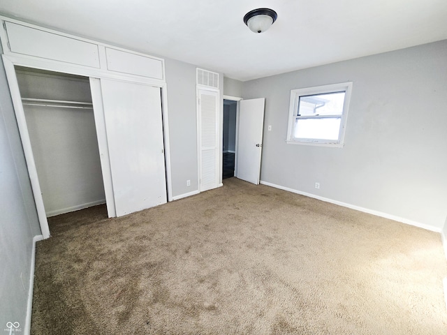 unfurnished bedroom with carpet floors