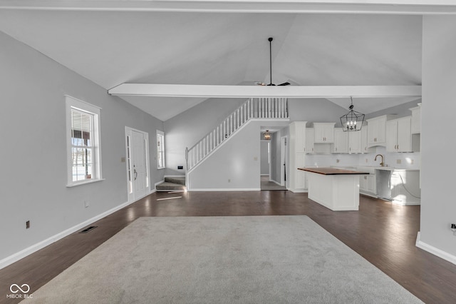 living room featuring ceiling fan, dark wood-type flooring, sink, and high vaulted ceiling