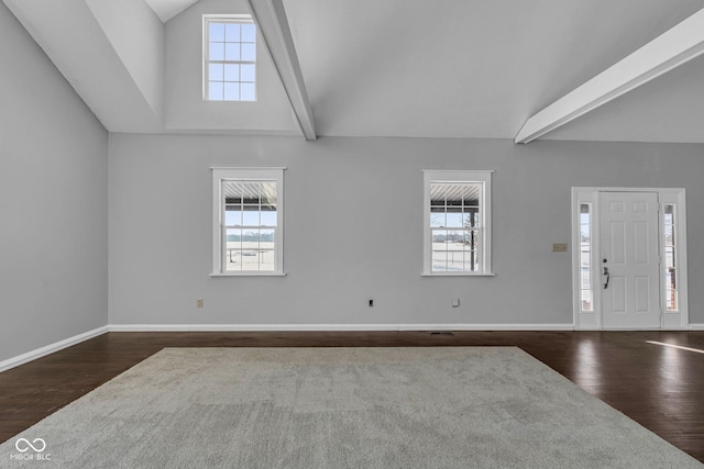 foyer featuring plenty of natural light, dark hardwood / wood-style flooring, and beam ceiling