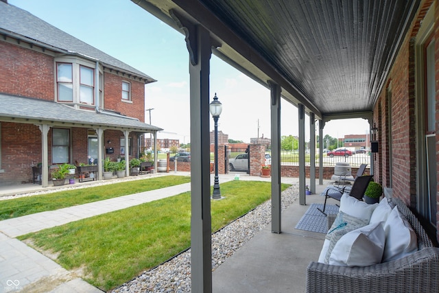 view of patio featuring a porch