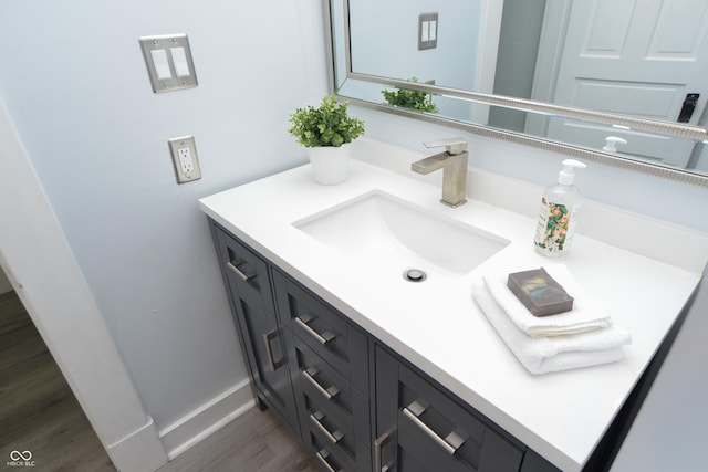 bathroom featuring hardwood / wood-style flooring and vanity