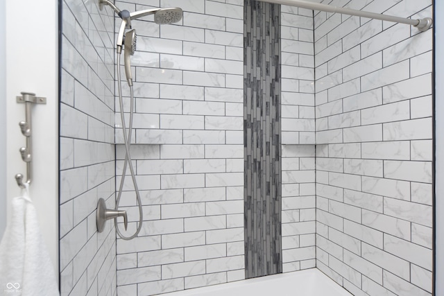 bathroom with tiled shower