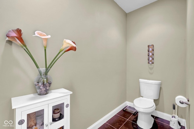 bathroom featuring toilet and tile patterned floors