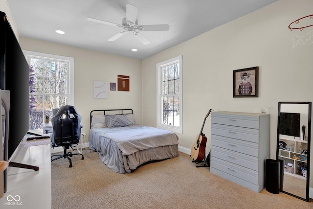 bedroom featuring ceiling fan and light colored carpet