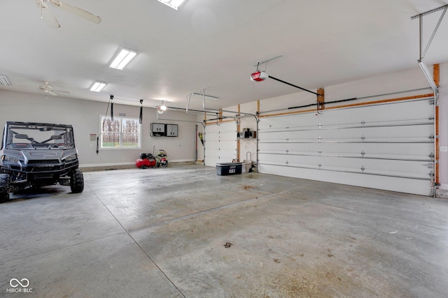 garage with ceiling fan and a garage door opener