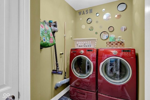 laundry room featuring tile patterned floors and washer and clothes dryer