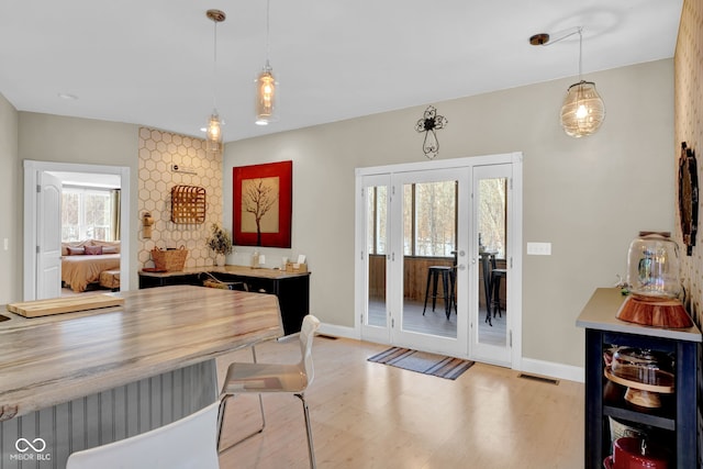 interior space with light wood-type flooring and a wealth of natural light