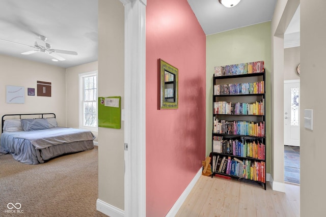 carpeted bedroom with ceiling fan