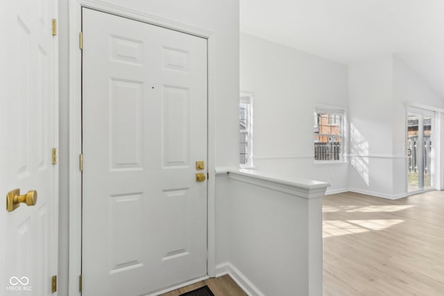 entryway with light hardwood / wood-style floors