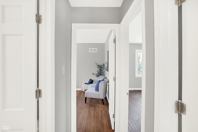 hall with dark hardwood / wood-style floors