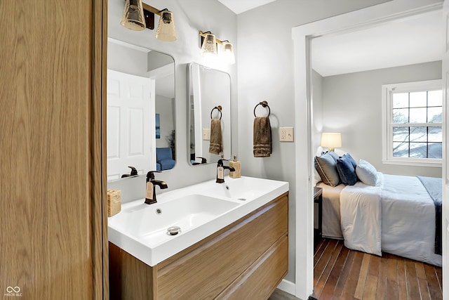 bathroom with vanity and hardwood / wood-style floors