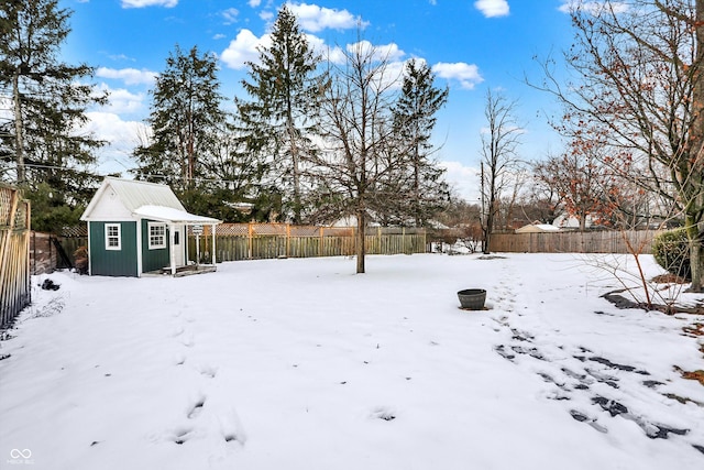 yard covered in snow with an outdoor structure