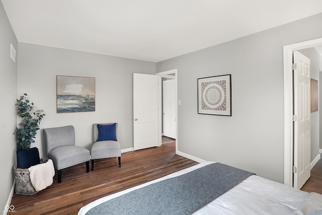 bedroom featuring dark hardwood / wood-style flooring