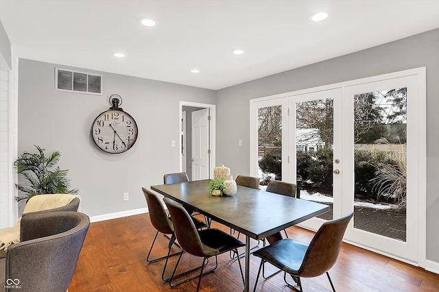 dining room with dark wood-type flooring and french doors