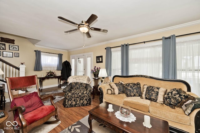 living room with ceiling fan, wood-type flooring, and ornamental molding