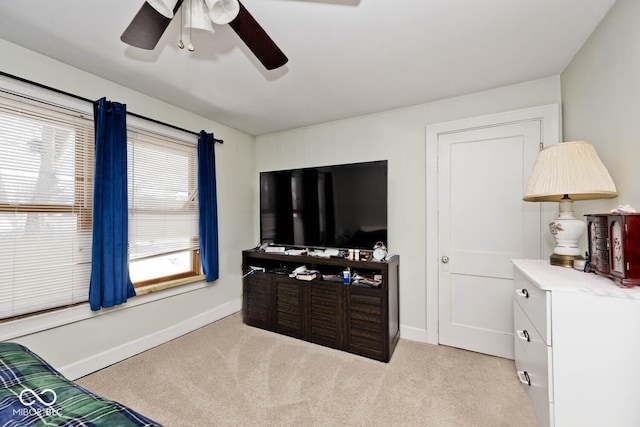 bedroom with ceiling fan and light colored carpet