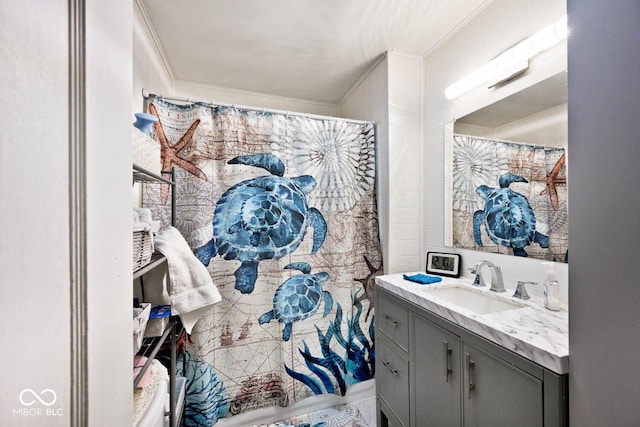 bathroom with crown molding and vanity