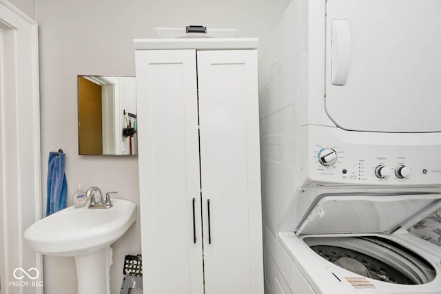 laundry area featuring stacked washing maching and dryer