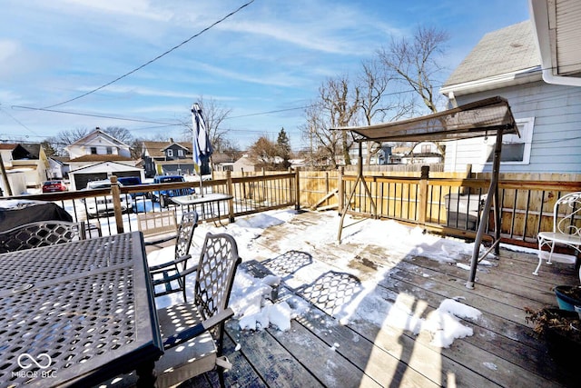 view of snow covered deck