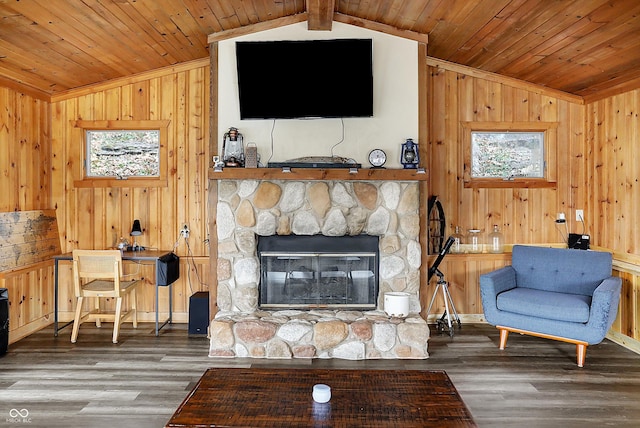 living room featuring a stone fireplace, wood-type flooring, lofted ceiling with beams, and wooden ceiling