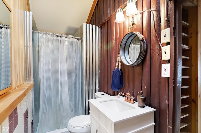 bathroom featuring vanity, toilet, and a shower with shower curtain